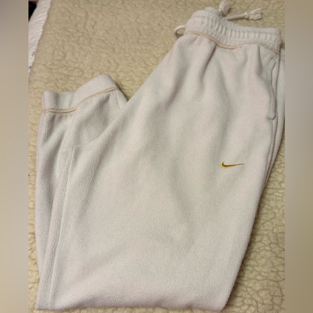 Men’s Nike, Dry- Fit Joggers in cream with Gold Logo.